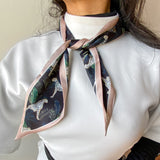 Small satin scarf black design, worn in a simple knot