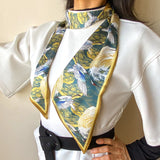 Satin scarf with Japanese stork design, worn around the neck