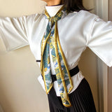 Satin scarf with Japanese stork design, worn in simple knot
